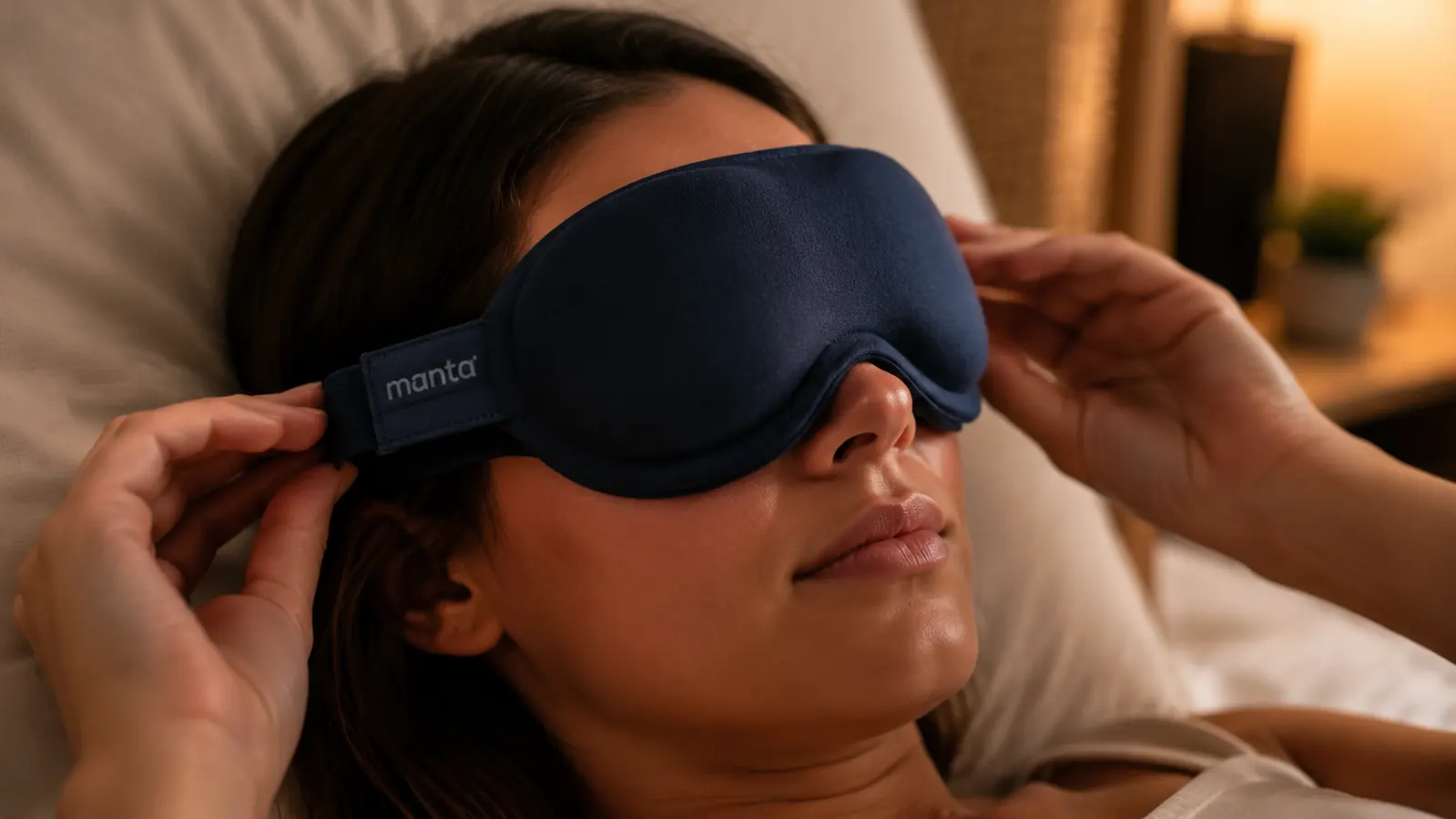 Close-up of adjustable Manta sleep mask eye cups positioned over closed eyes, showing the contoured gap that avoids lash contact